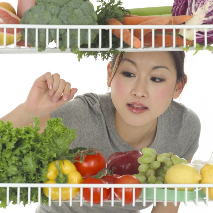 woman choosing fruits and vegetables for hemorrhoids cure 